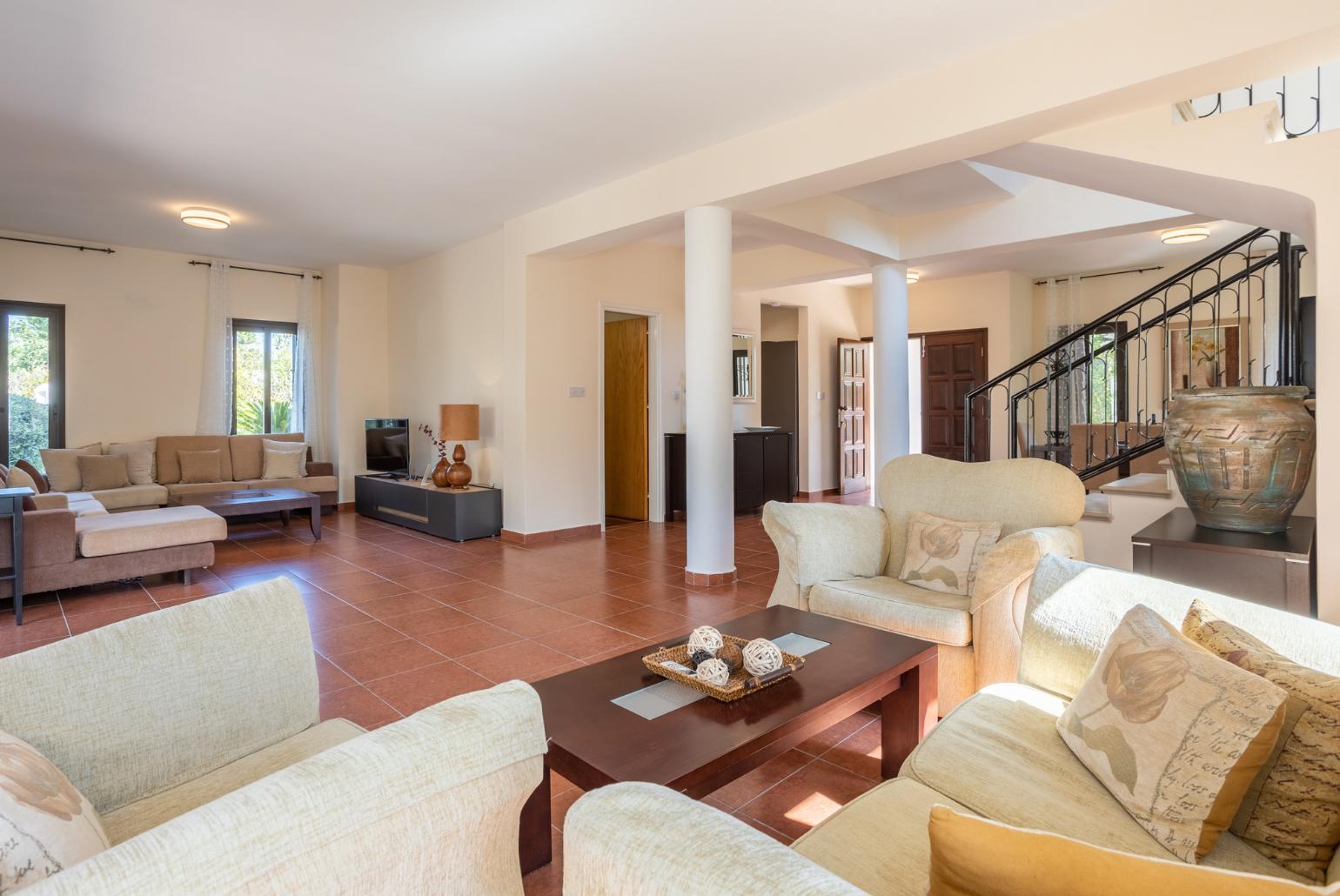 Living room with sofas, dining area, WiFi internet, and satellite TV