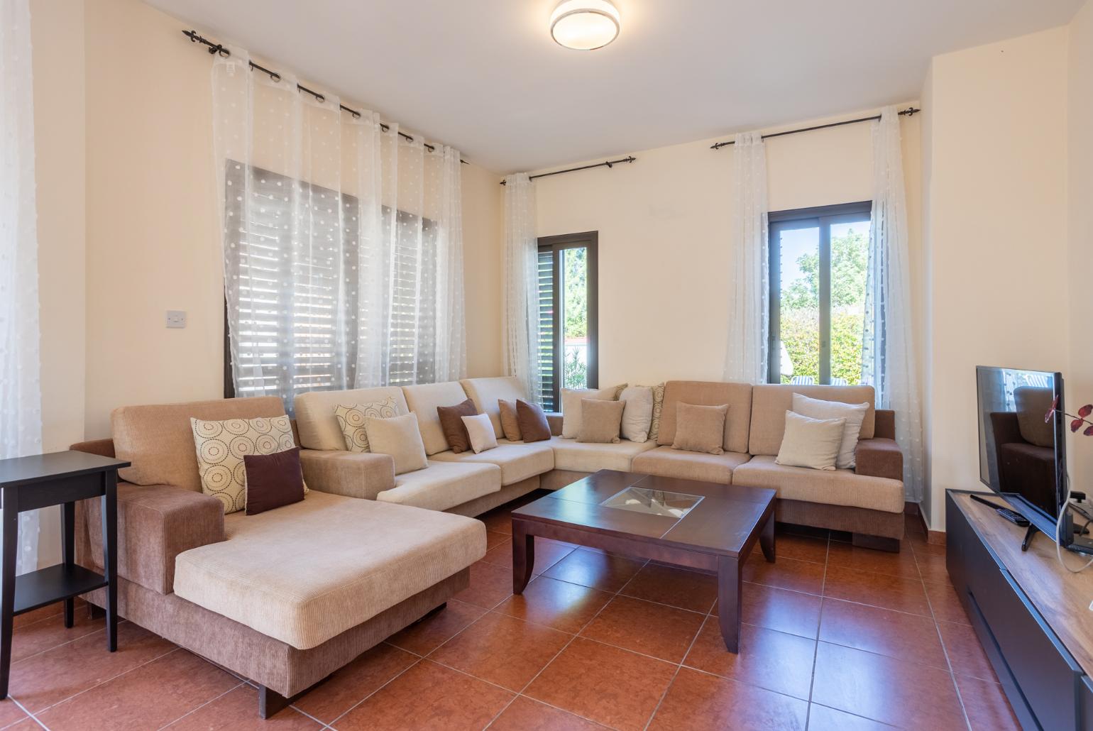 Living room with sofas, dining area, WiFi internet, and satellite TV