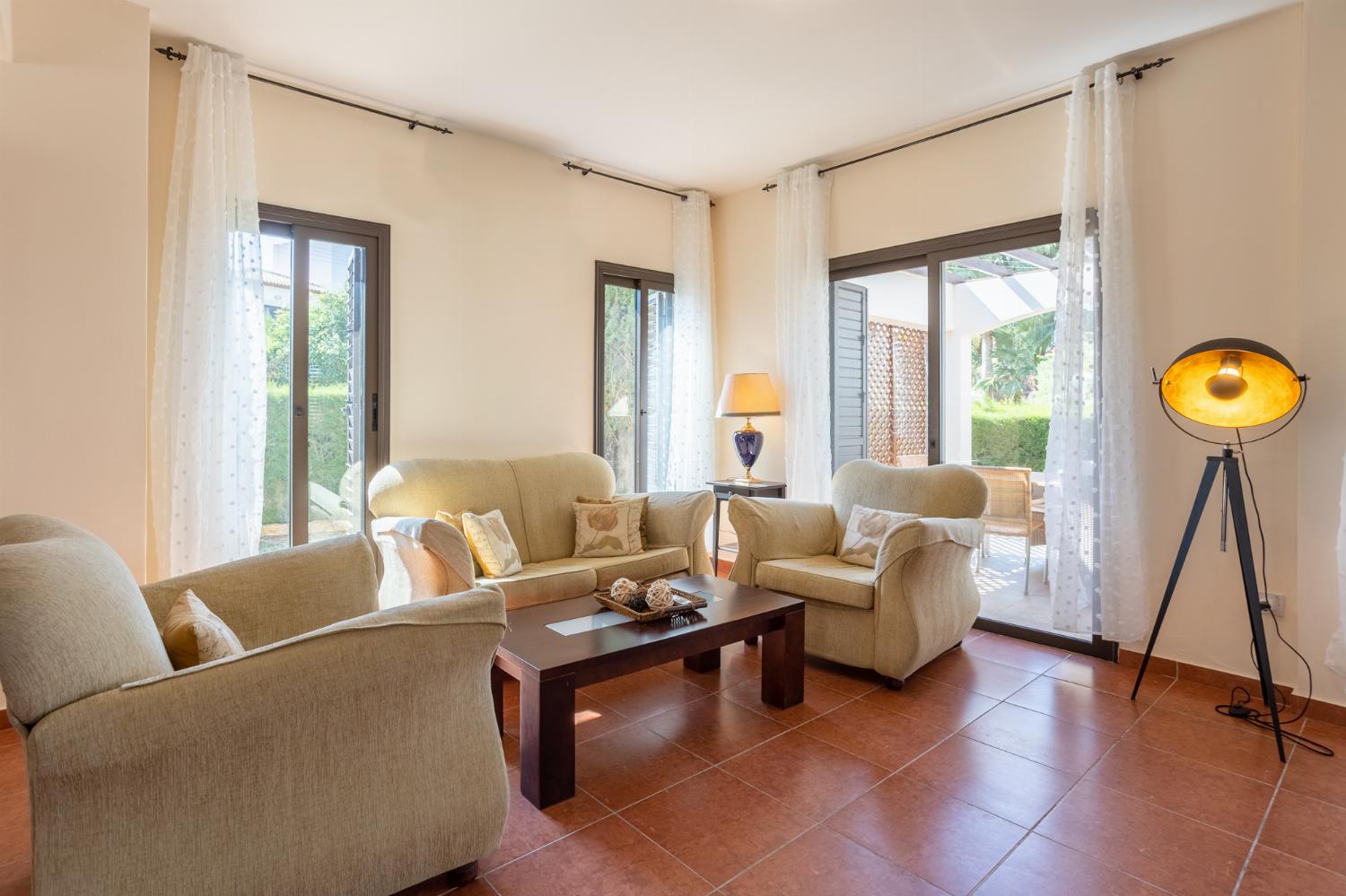 Living room with sofas, dining area, WiFi internet, and satellite TV