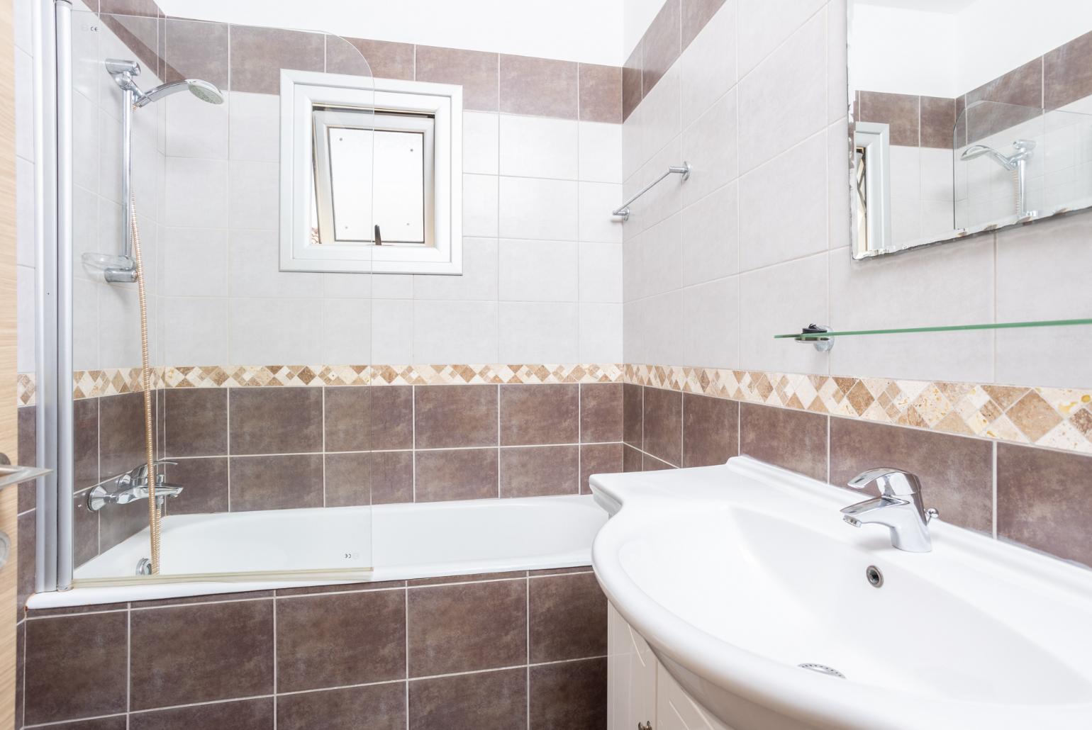 Family bathroom with bath and shower