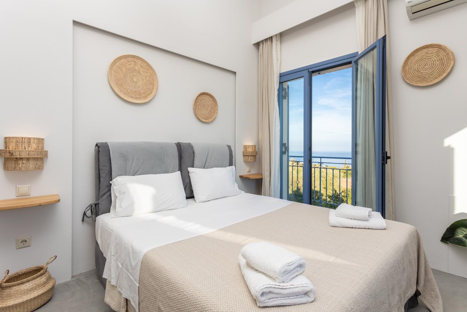 Double bedroom with A/C and balcony with sea views