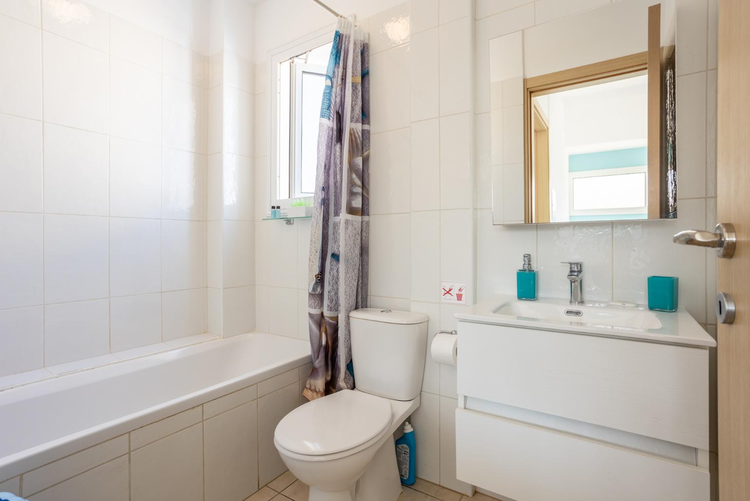 Family bathroom with bath and shower