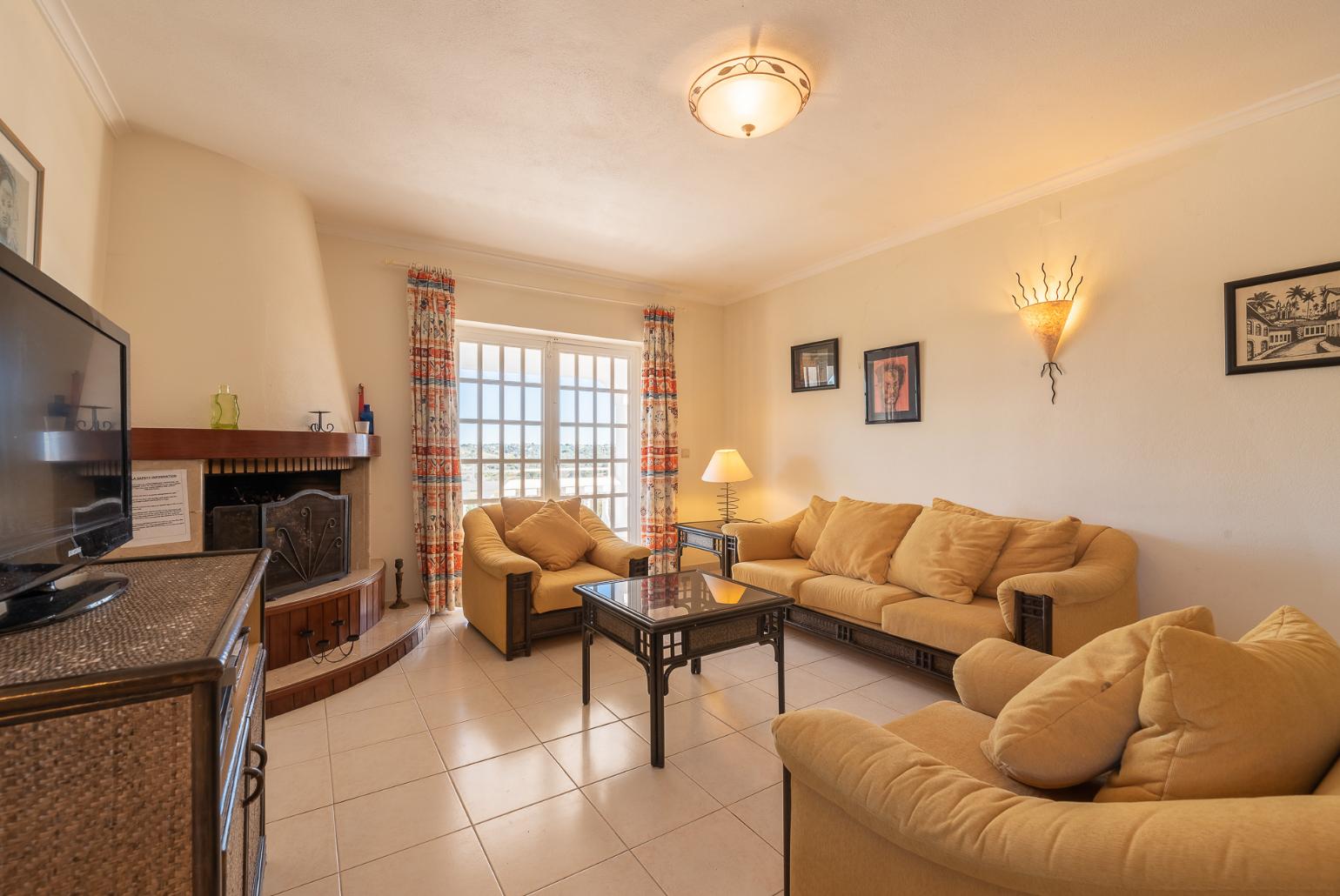 Living room with TV, wi-fi and ornamental fire place