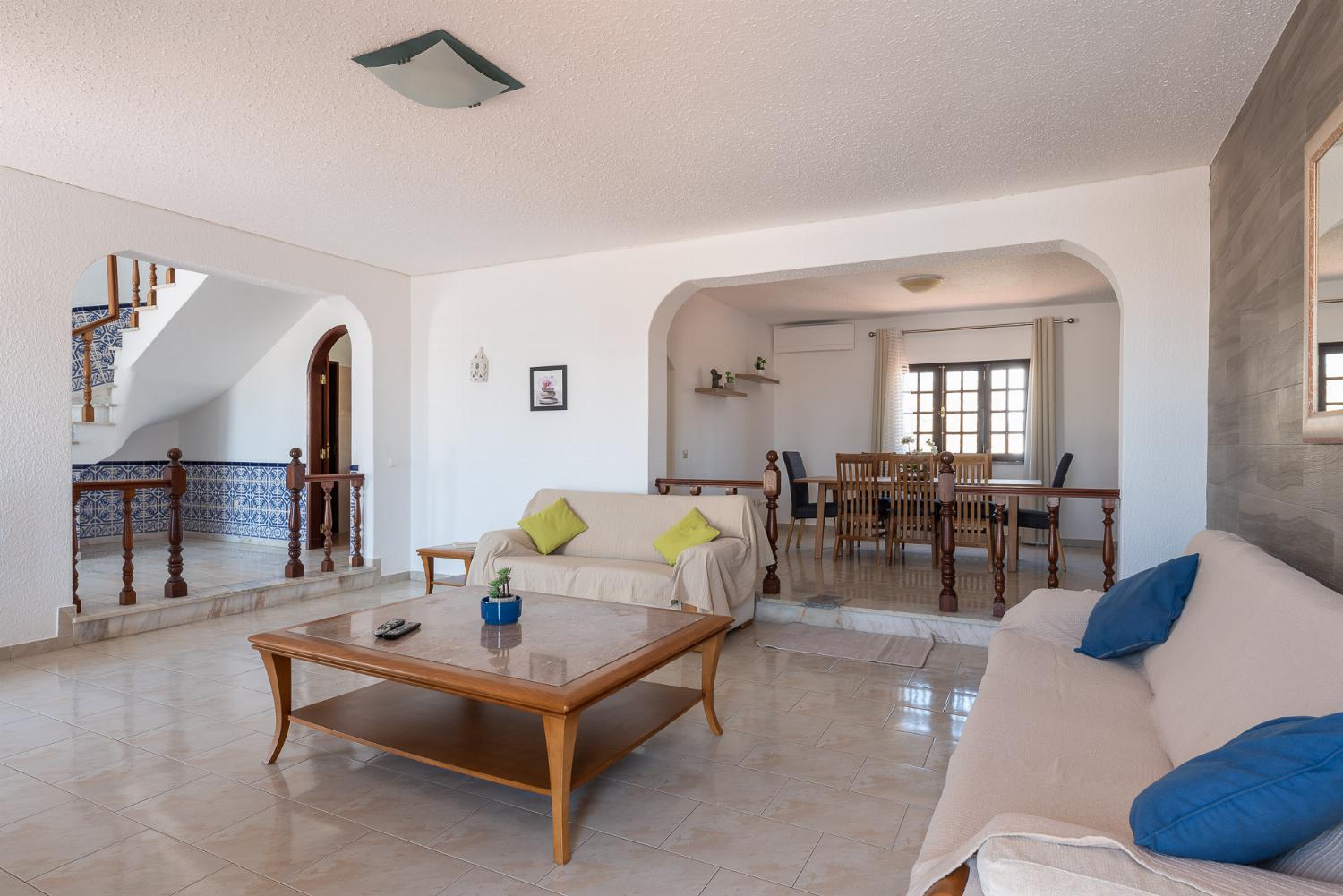 Living room with comfortable sofas and  access to the terrace.