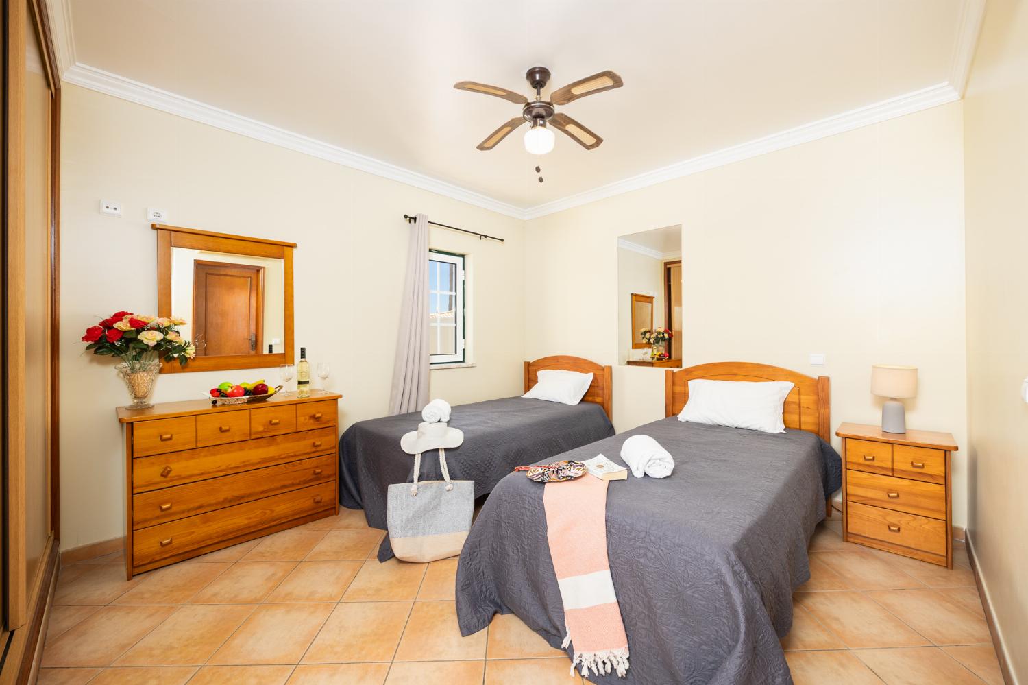 Twin bedroom with en suite bathroom and A/C