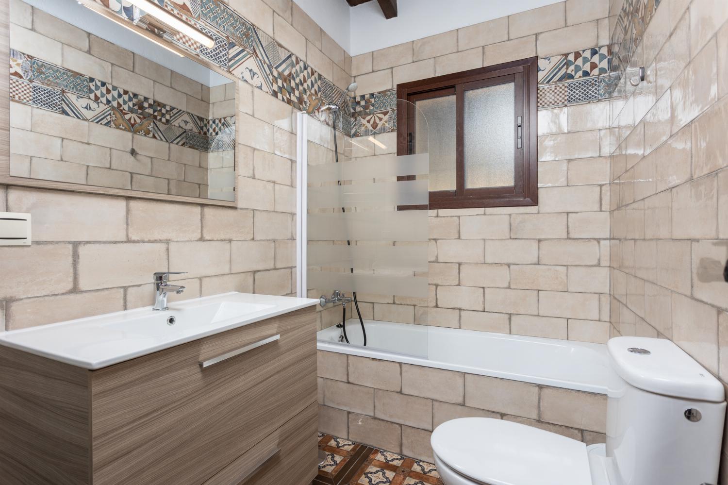 Family bathroom with bath and shower