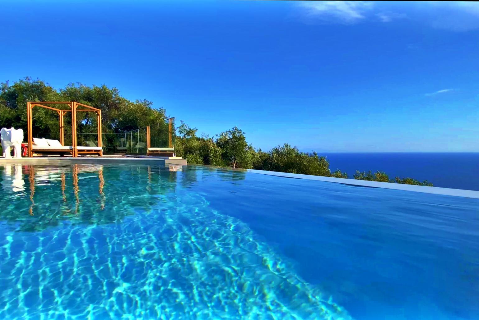 Private infinity pool and terrace with panoramic sea views