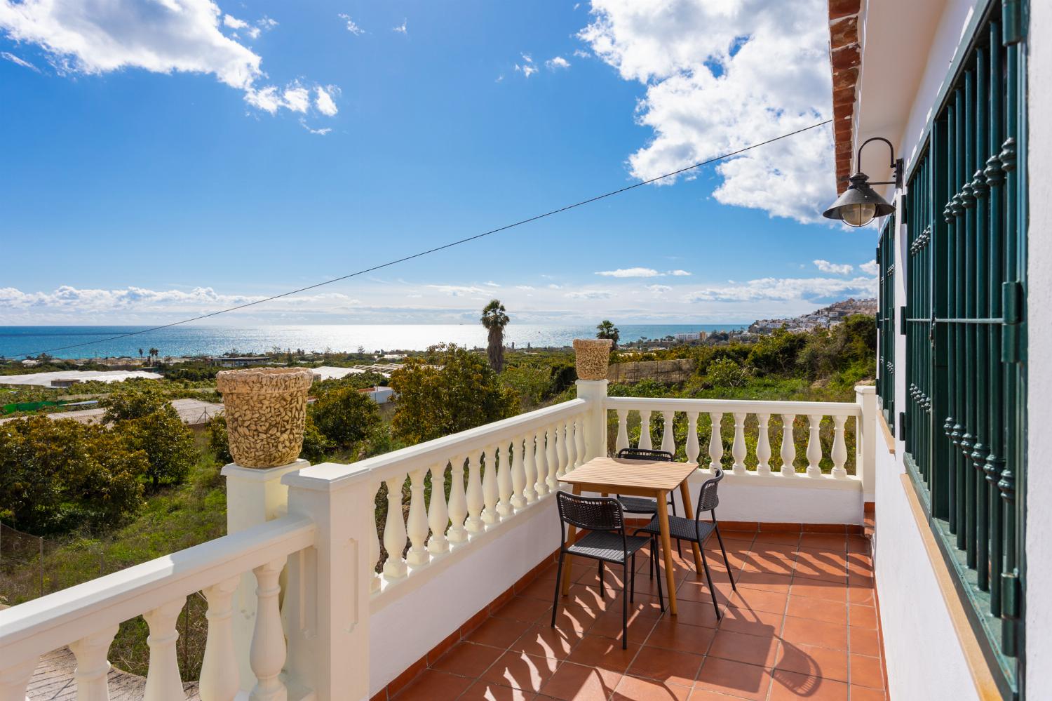 Upper terrace area with sea views