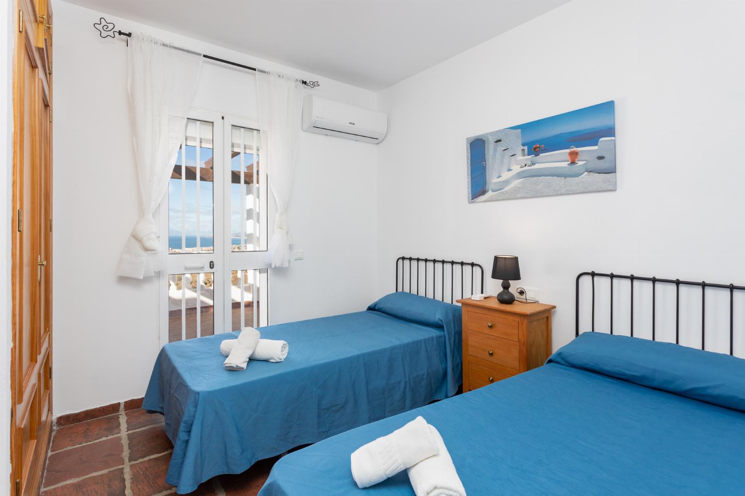 Twin bedroom with A/C and sea views