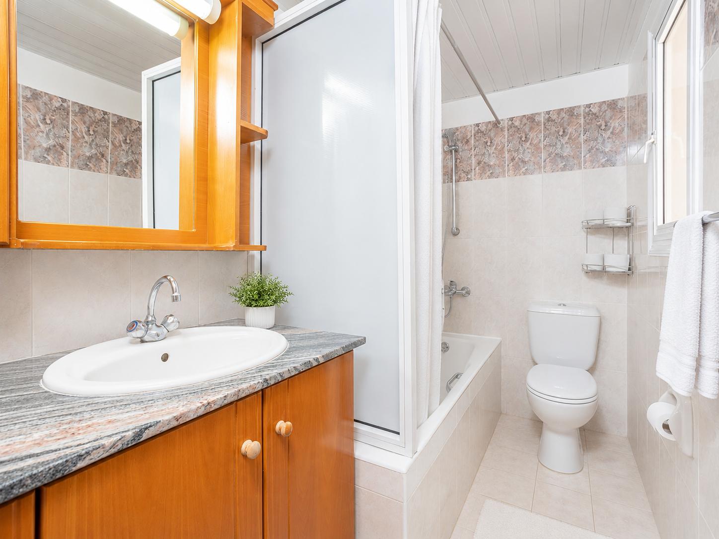 Family bathroom with bath and shower