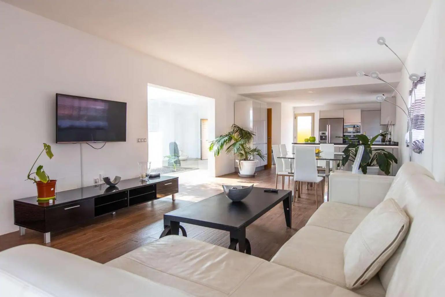 Living room with sofa, dining area, WiFi internet, satellite TV