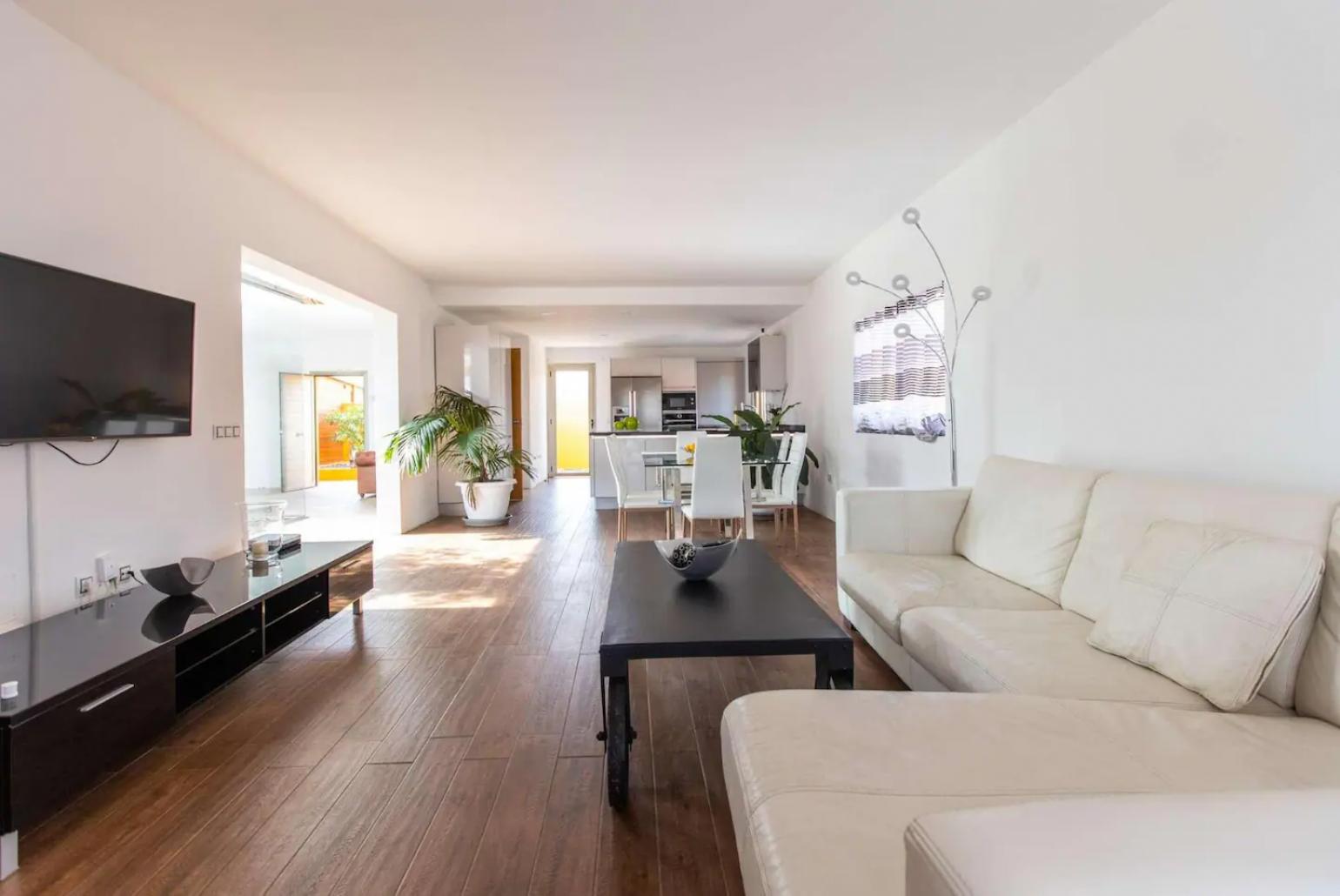 Living room with sofa, dining area, WiFi internet, satellite TV