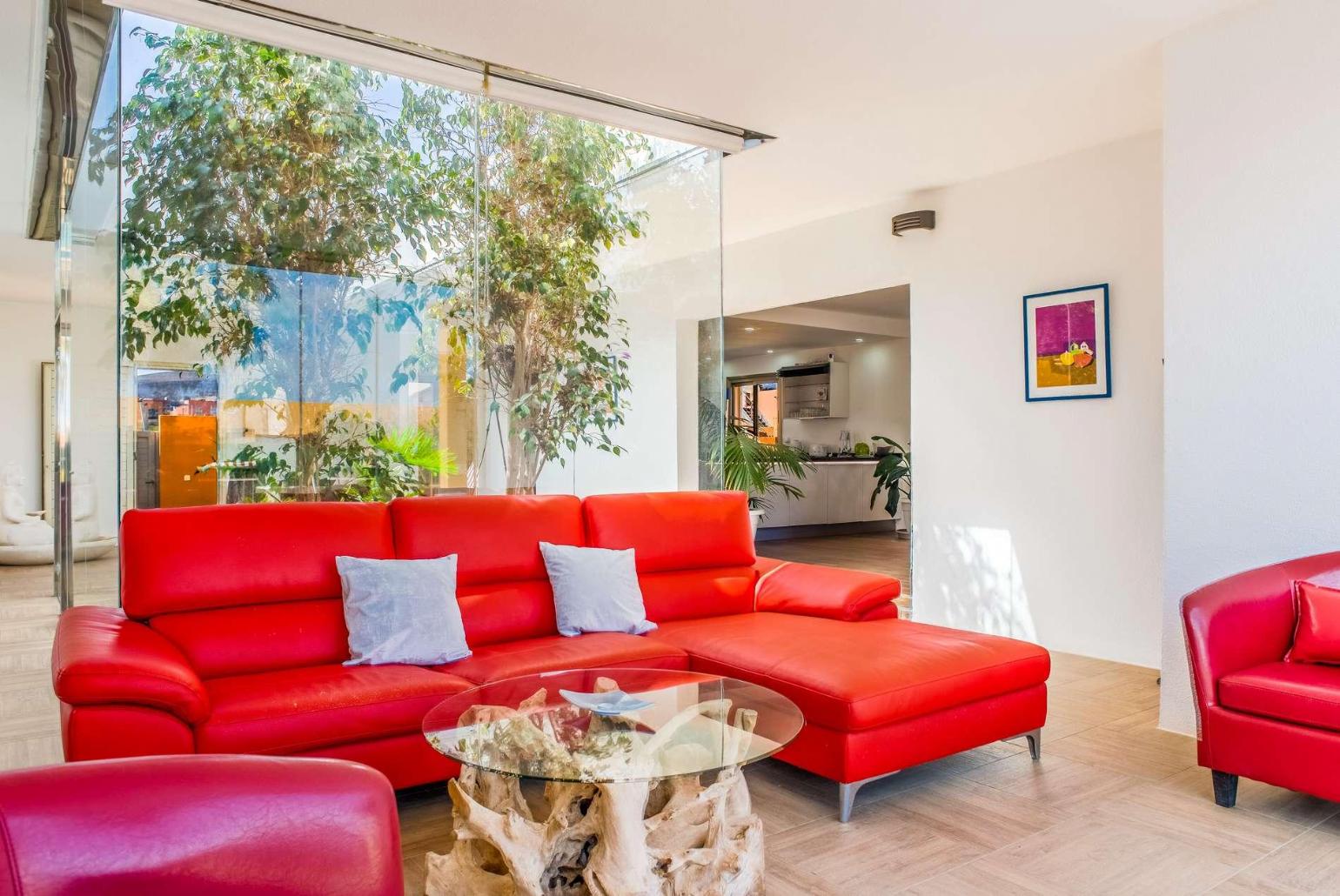 Second living area with sofa and terrace access