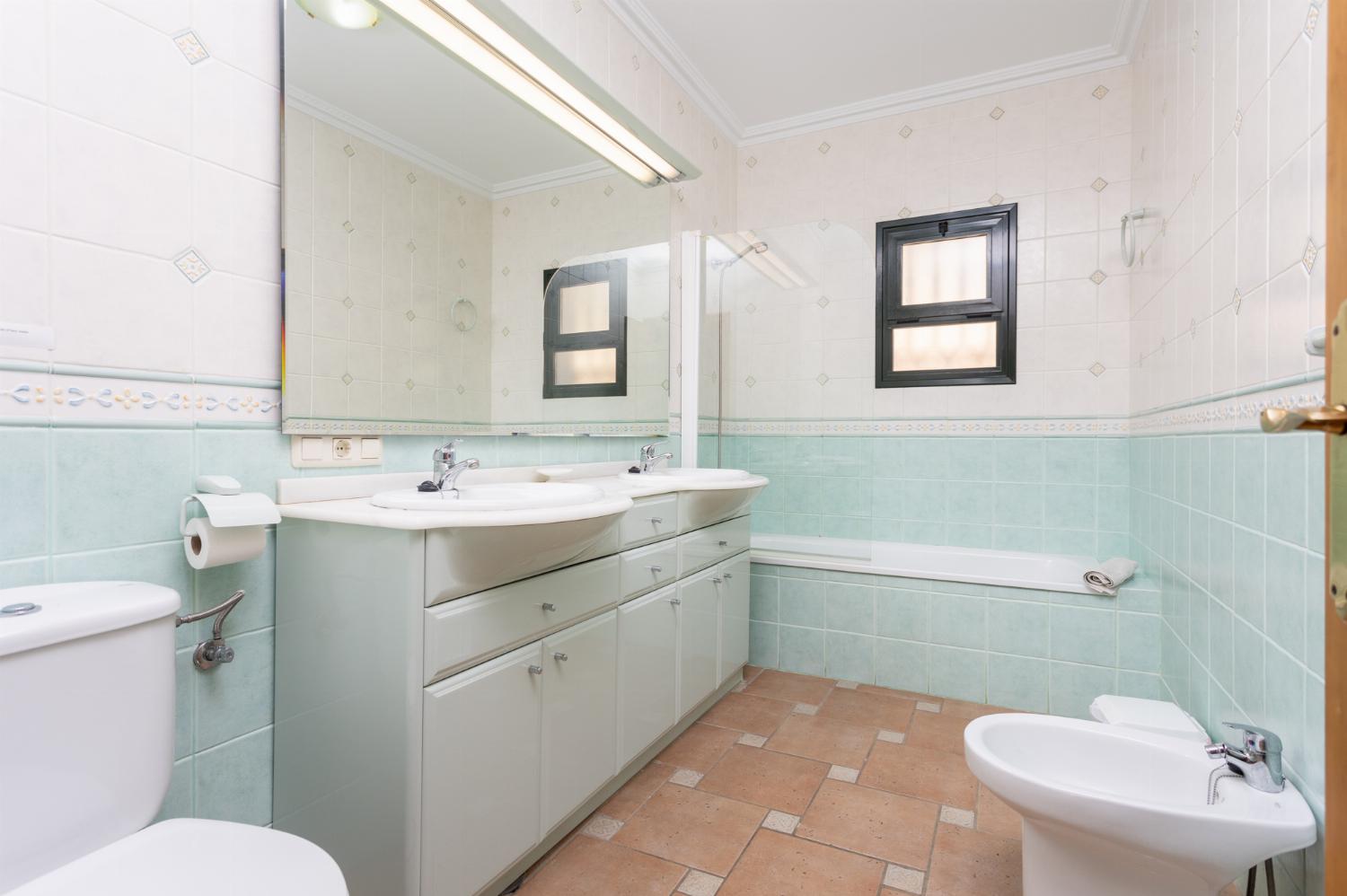 Family bathroom with bath and shower