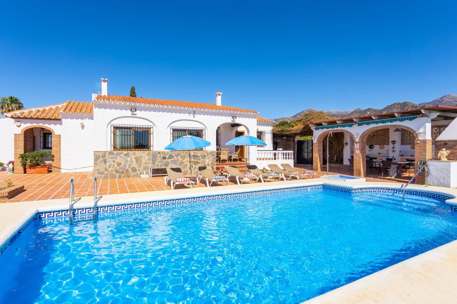 ,Beautiful villa with private pool, terrace, and garden with sea views