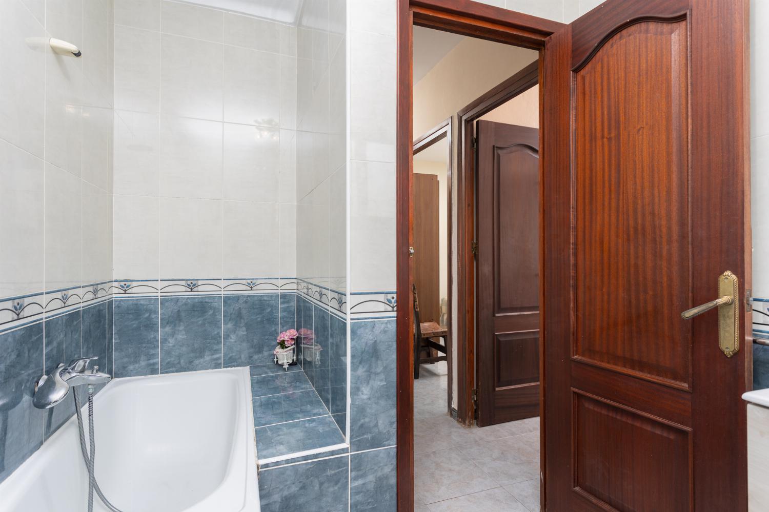 Family bathroom with bath and shower