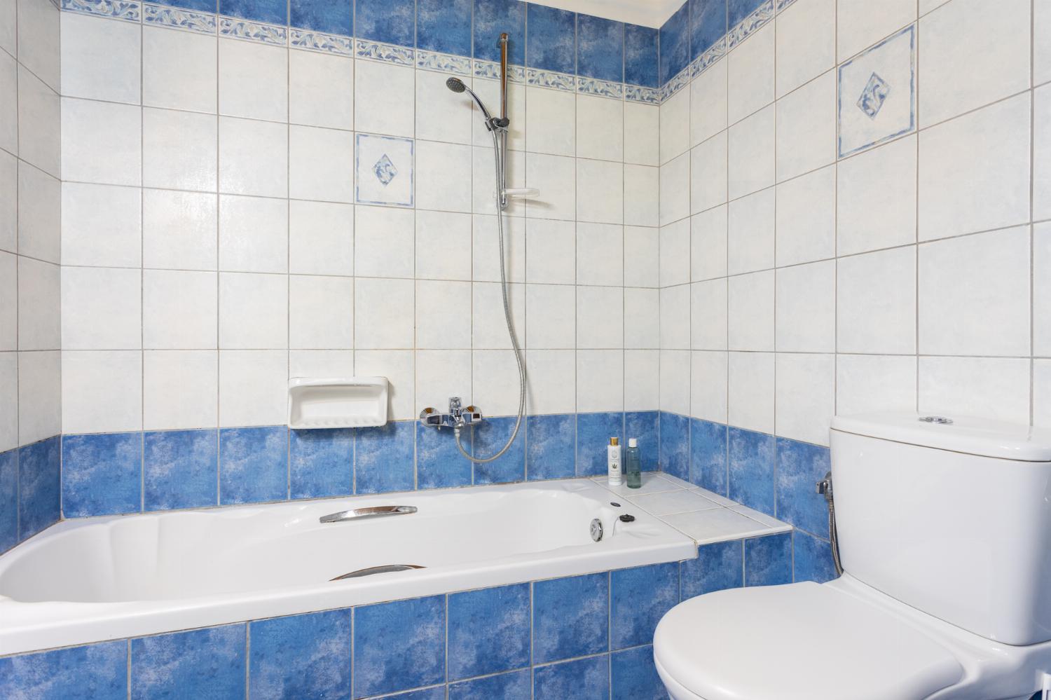 Family bathroom with bath and shower