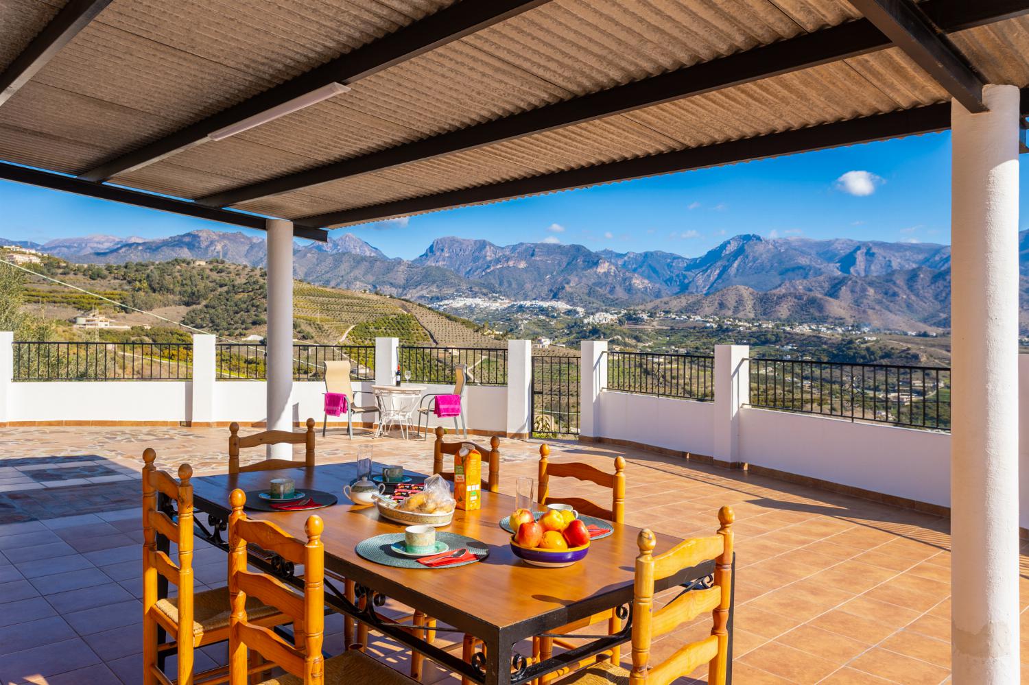 Sheltered terrace area with panoramic views of sea and mountains