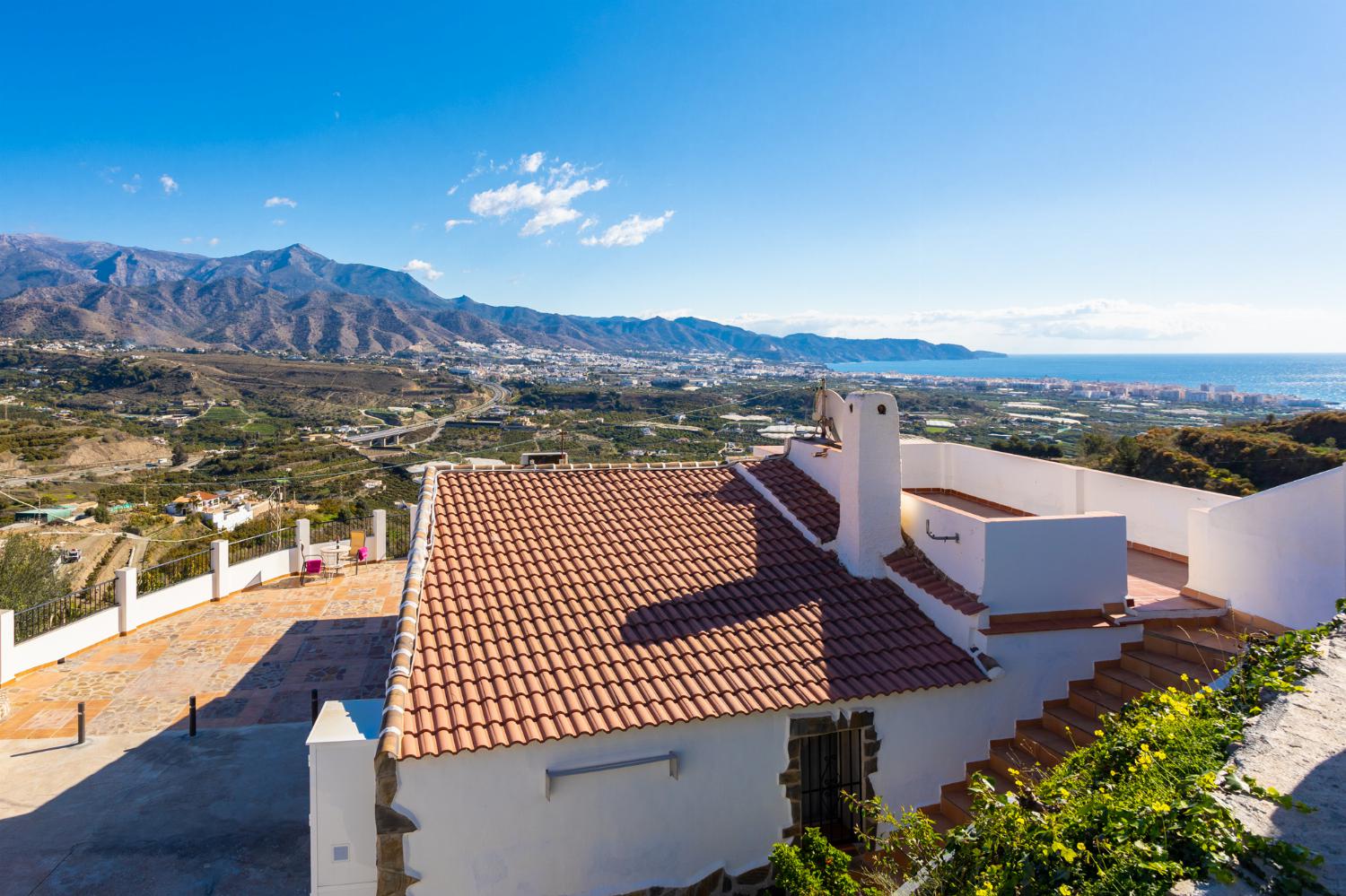 Sheltered terrace area with panoramic views of sea and mountains