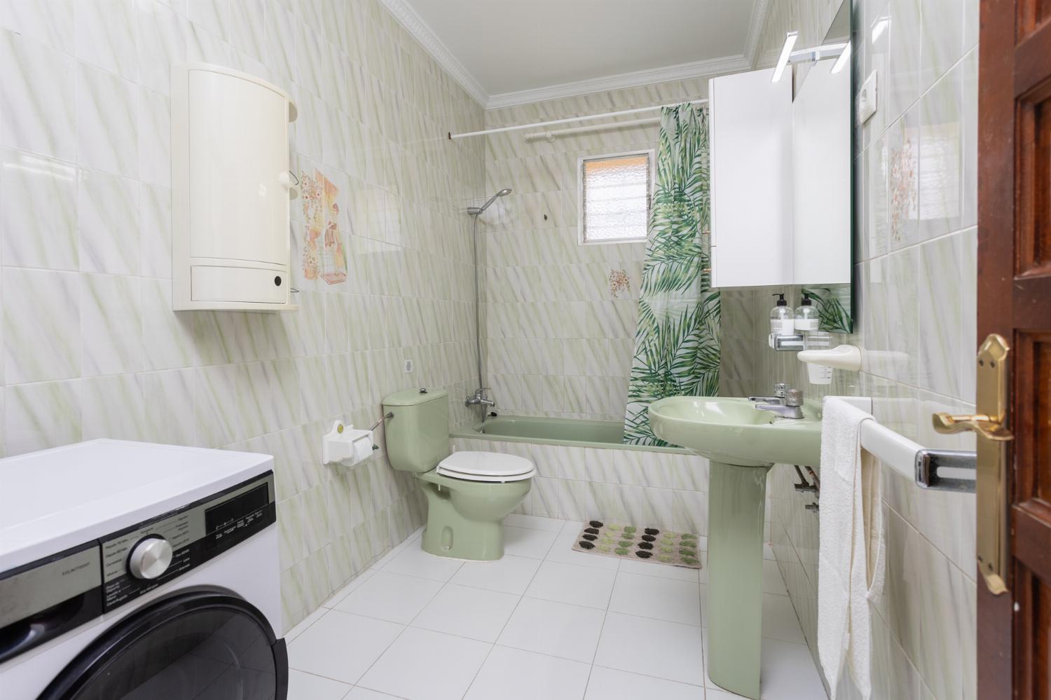 Family bathroom with bath and shower