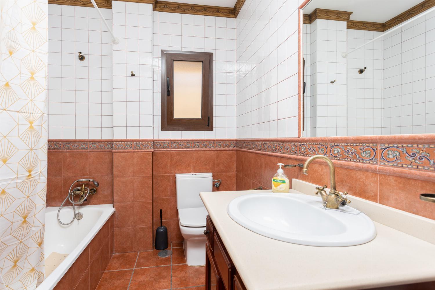 Family bathroom with bath and shower