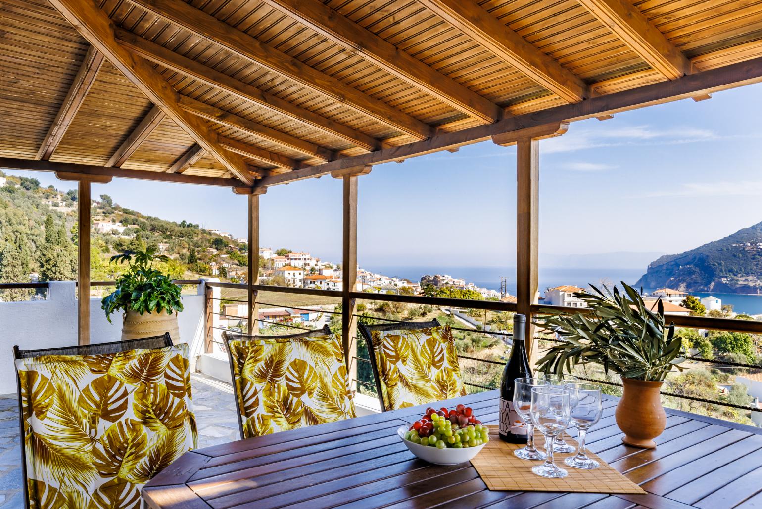 Terrace with dining table and sea view 