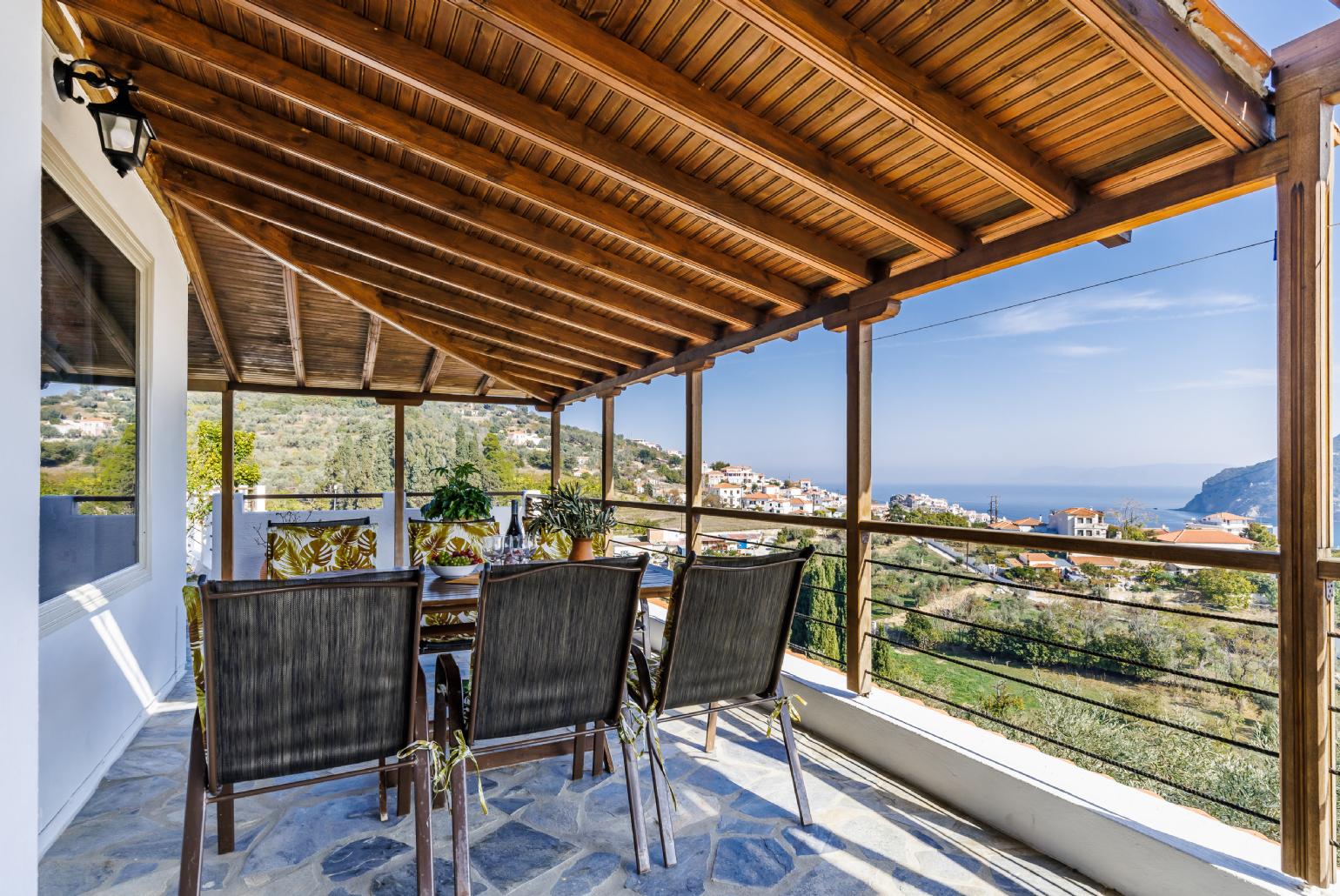 Terrace with dining table and sea view 