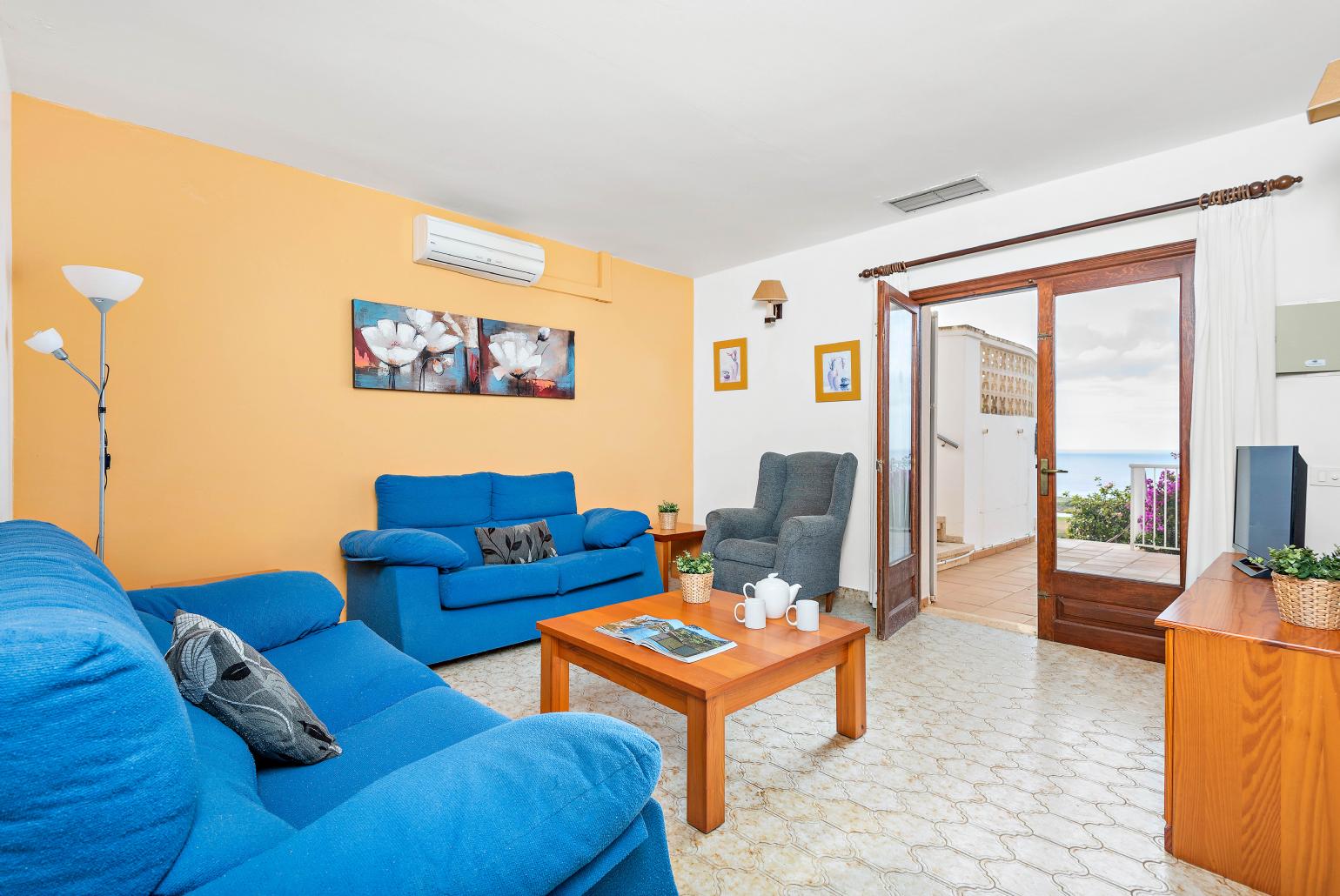 ,Living room area with A/C, and terrace access with a panoramic sea viewsea view