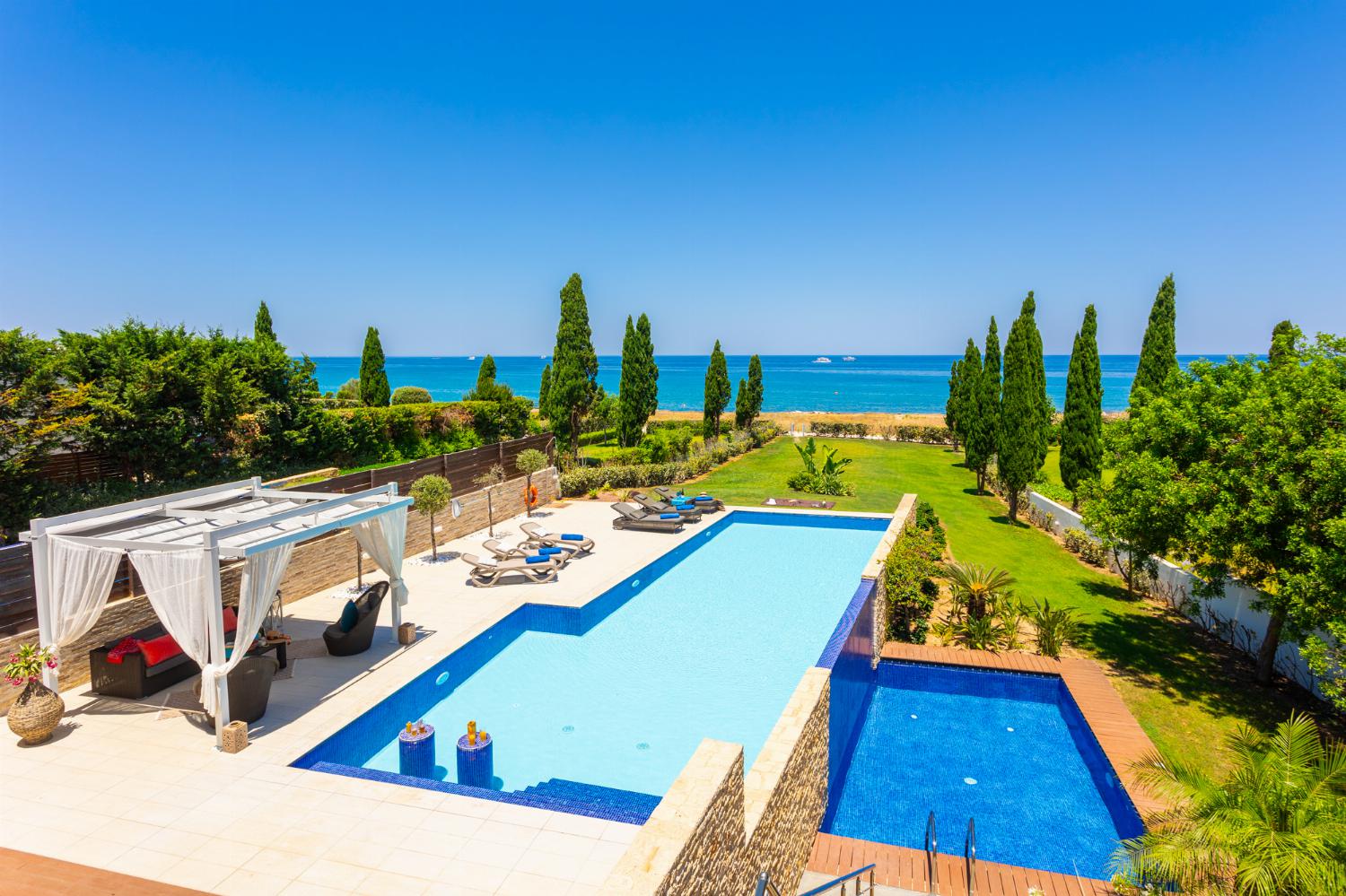 Private pools, terrace, and garden with panoramic sea views