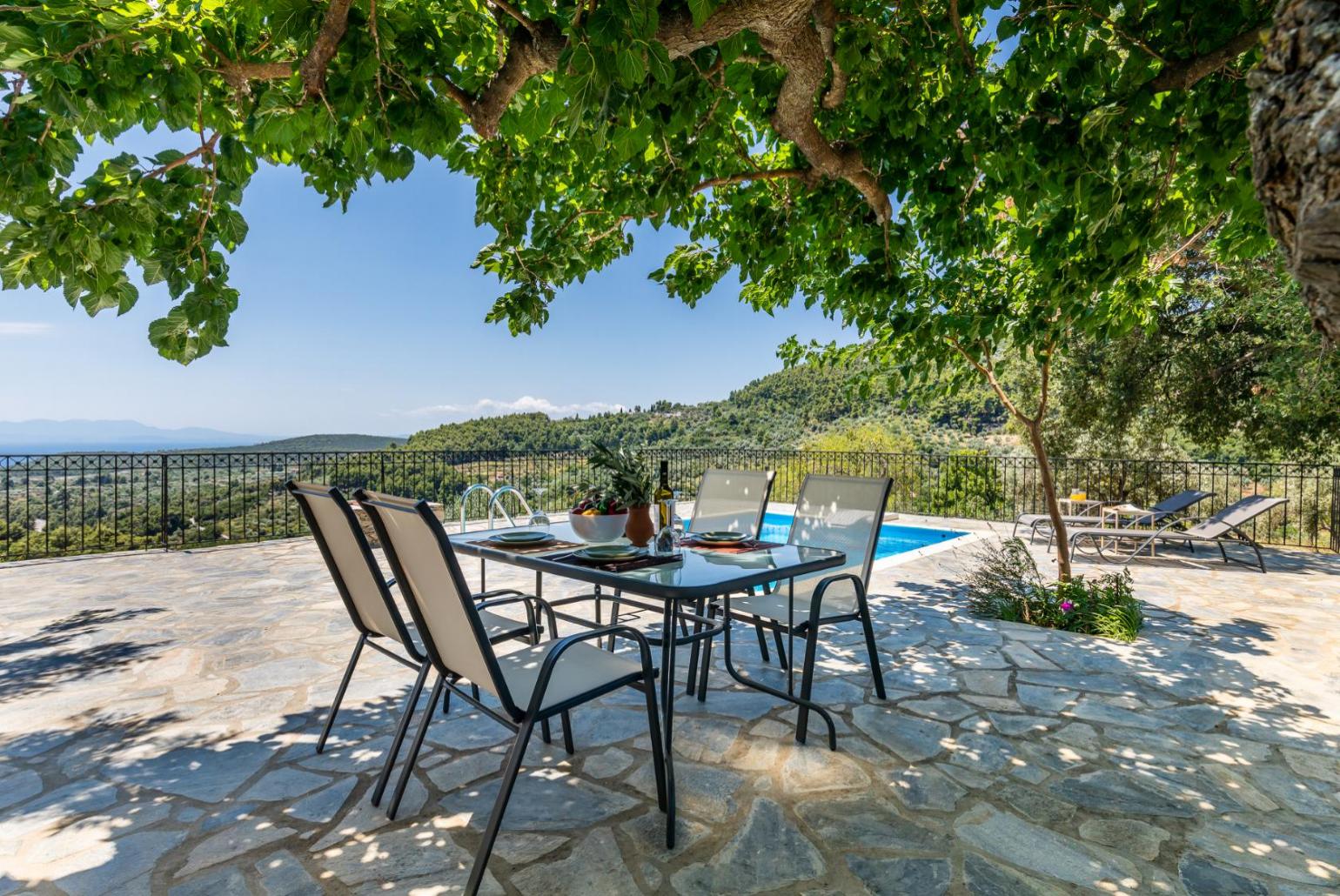 Terrace and outdoor dining area with a panoramic view