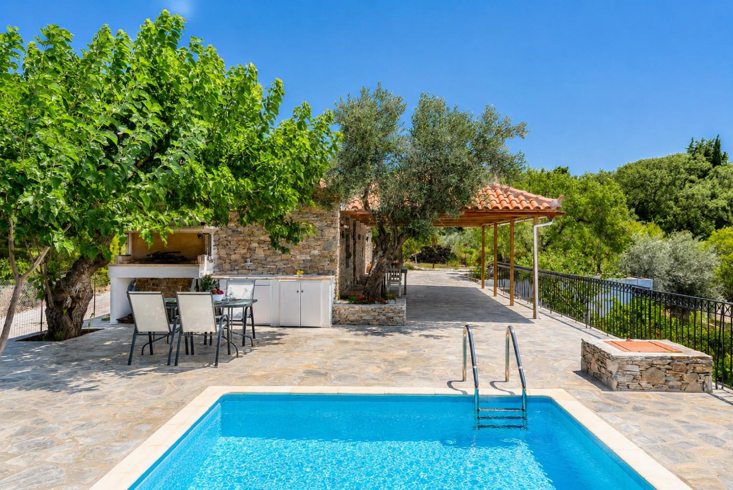 ,Beautiful villa with pool and outdoor dining