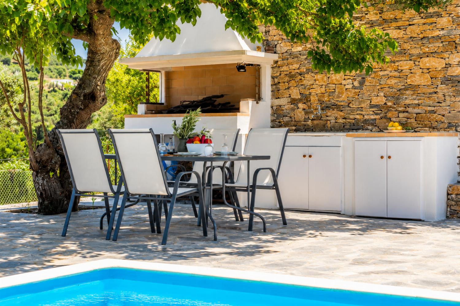 Outdoor dining area with barbecue