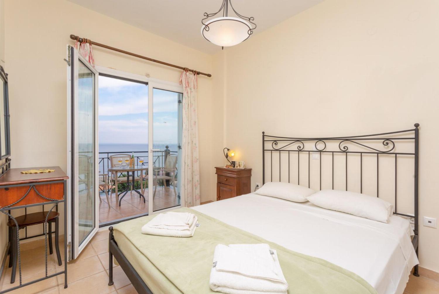 Double bedroom with A/C, and balcony access with sea views