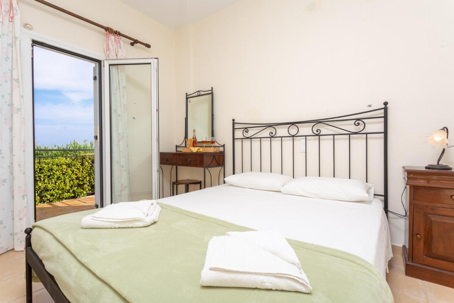 Double bedroom on ground floor with en suite bathroom, A/C and balcony access