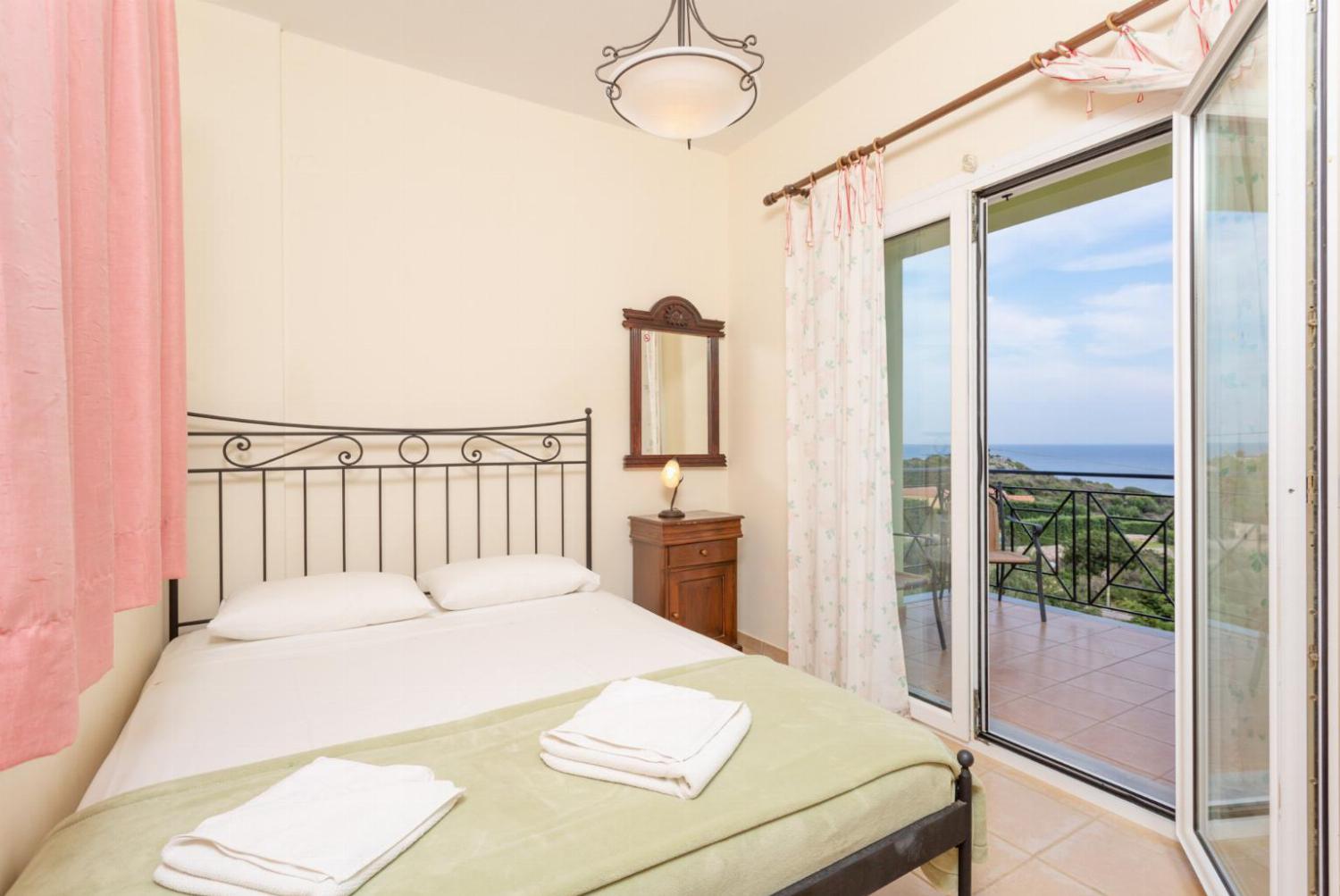 Double bedroom with A/C, and balcony access with sea views
