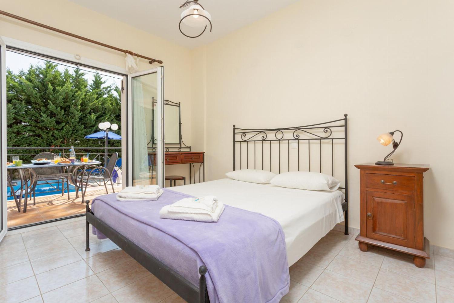 Double bedroom on ground floor, with en suite bathroom, A/C and terrace access to the pool