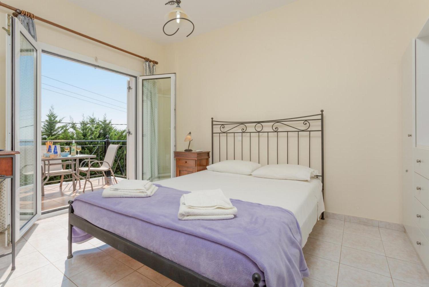 Double bedroom with A/C and terrace access to sea views