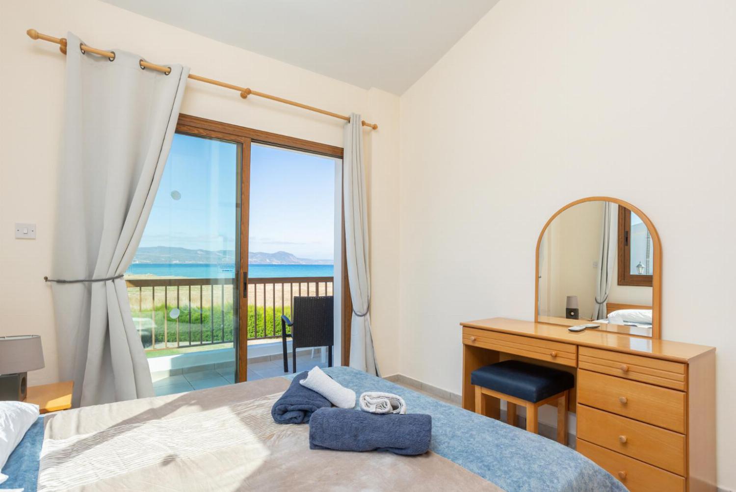 Double bedroom with A/C, sea views, and balcony access