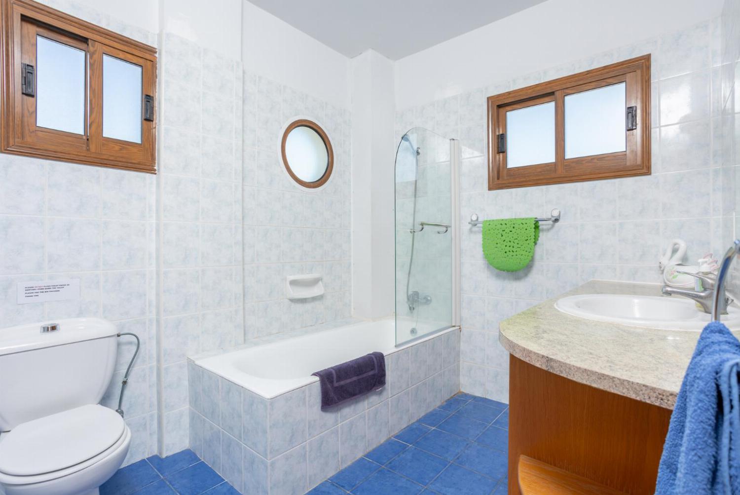 Family bathroom with bath and shower