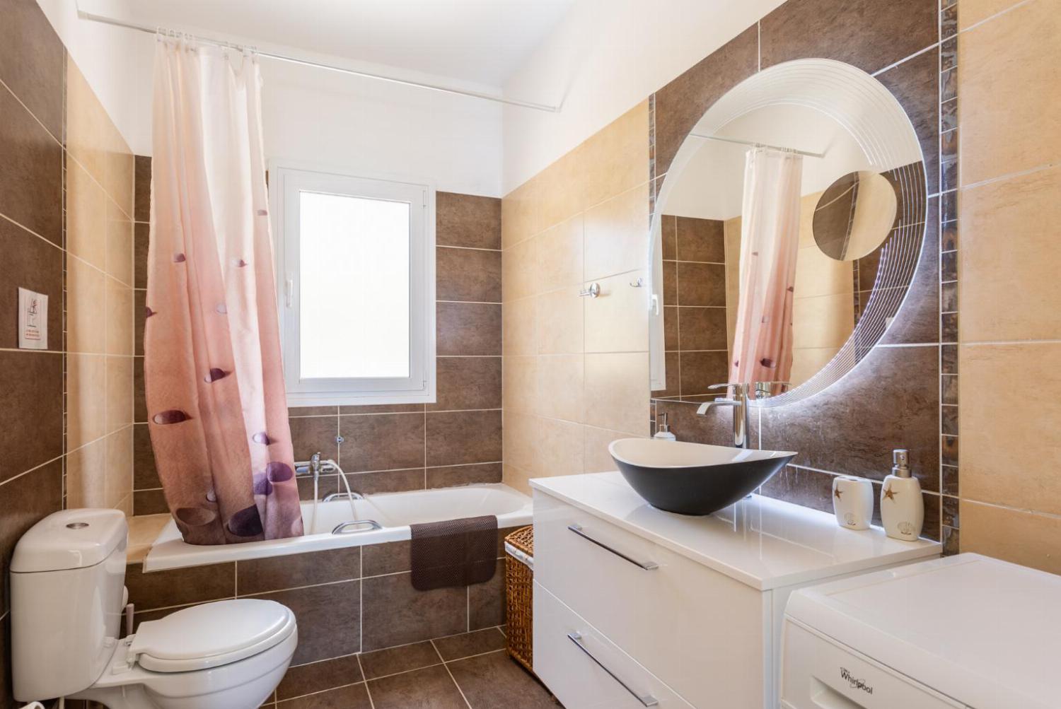 En suite bathroom with bath and shower