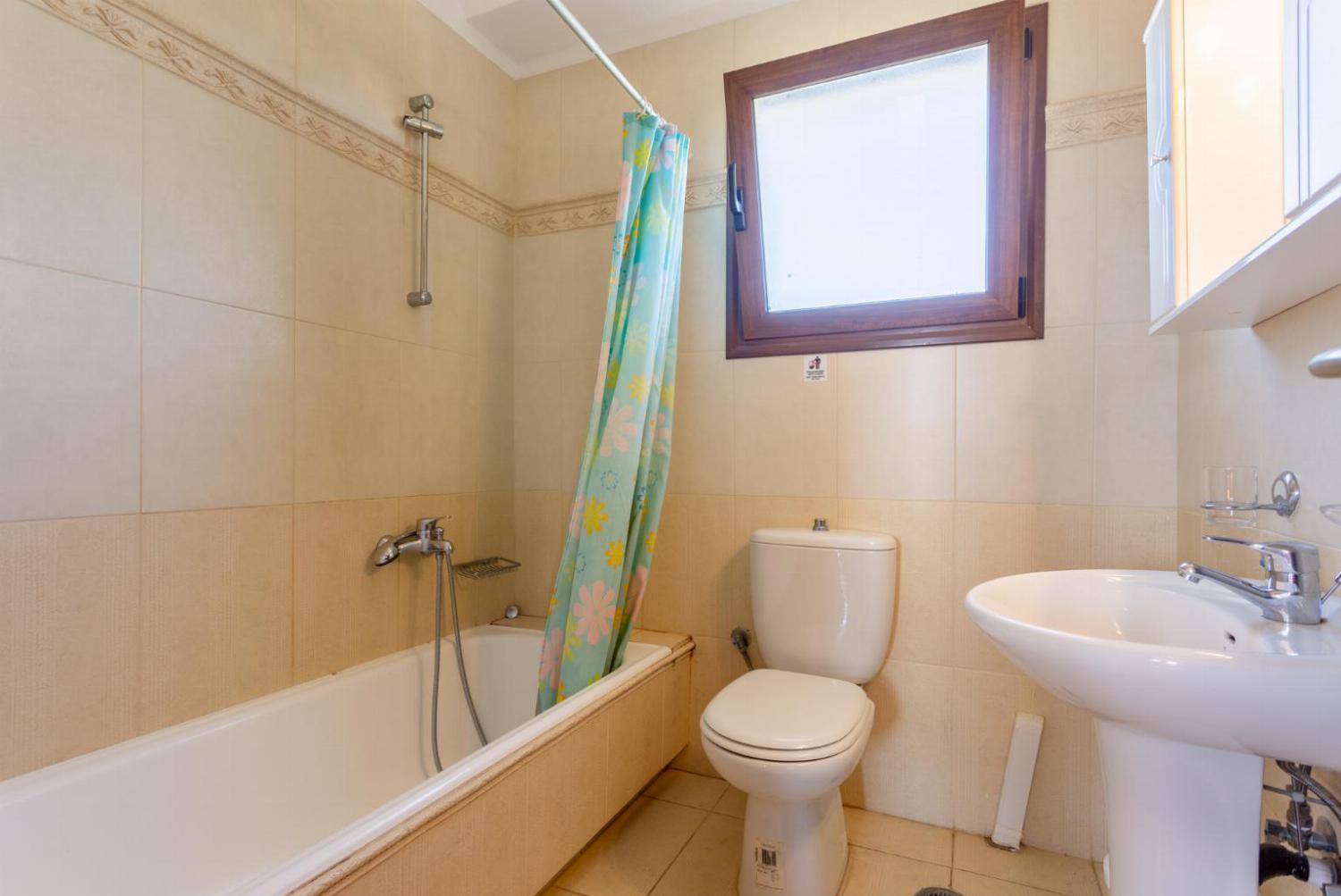 Family bathroom with bath and shower