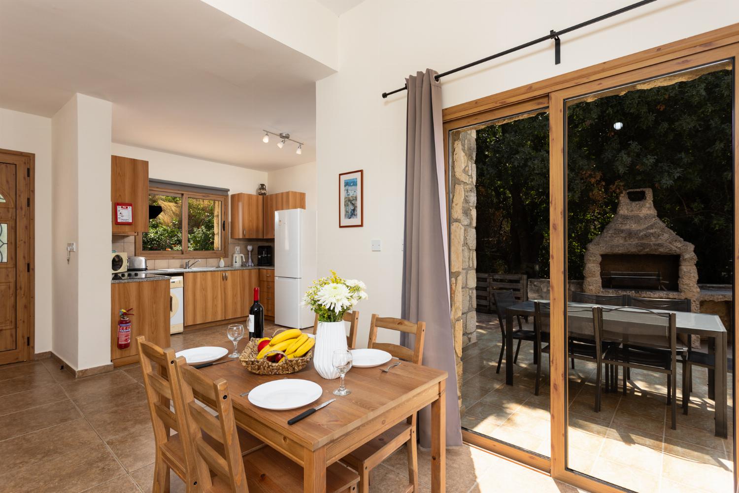 Equipped kitchen with dining area and outdoor BBQ