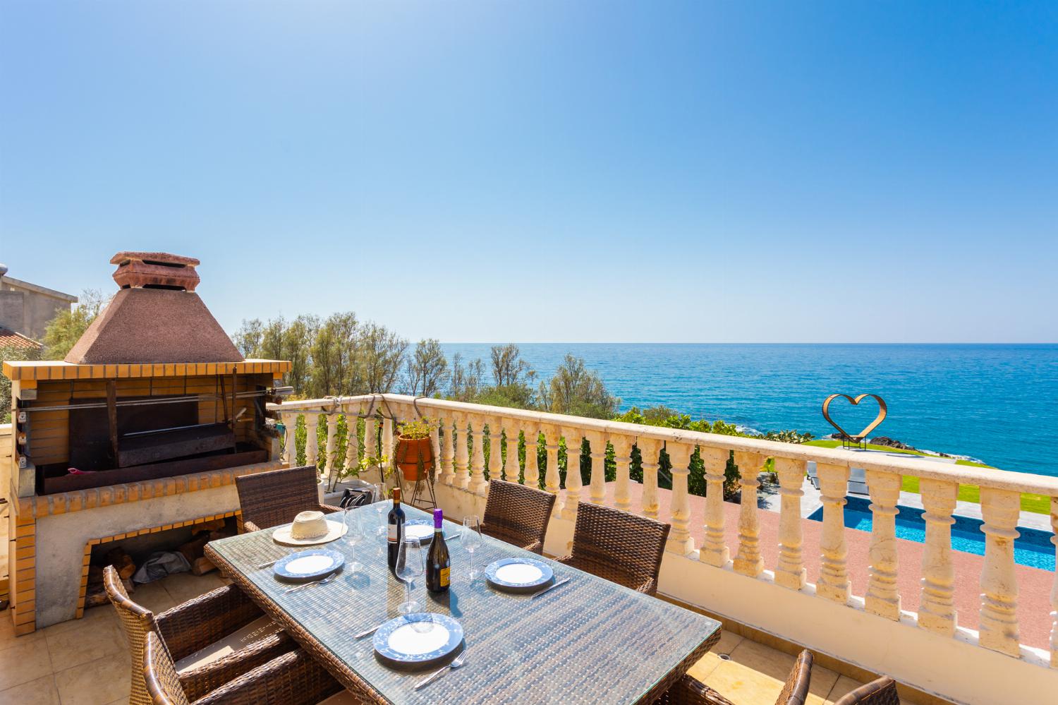 Terrace area with BBQ and sea views