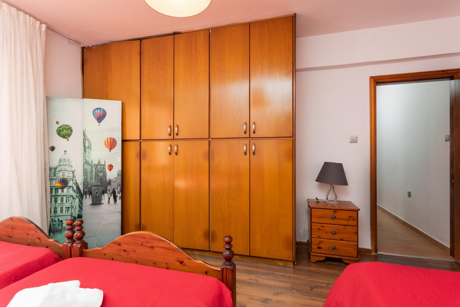 Front apartment: bedroom (one double bed, two singles) with A/C