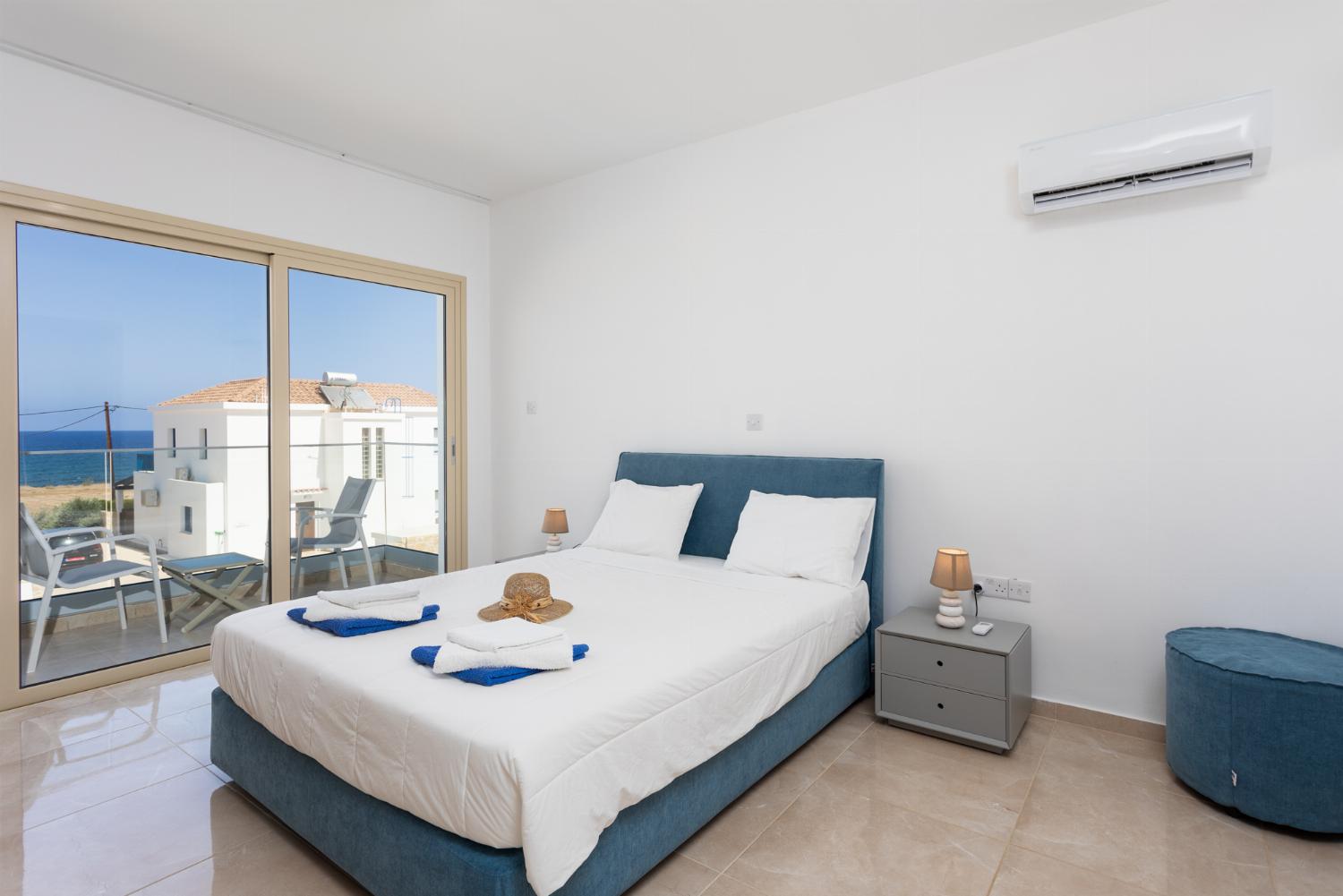 Double bedroom with en suite bathroom, A/C, and sea views