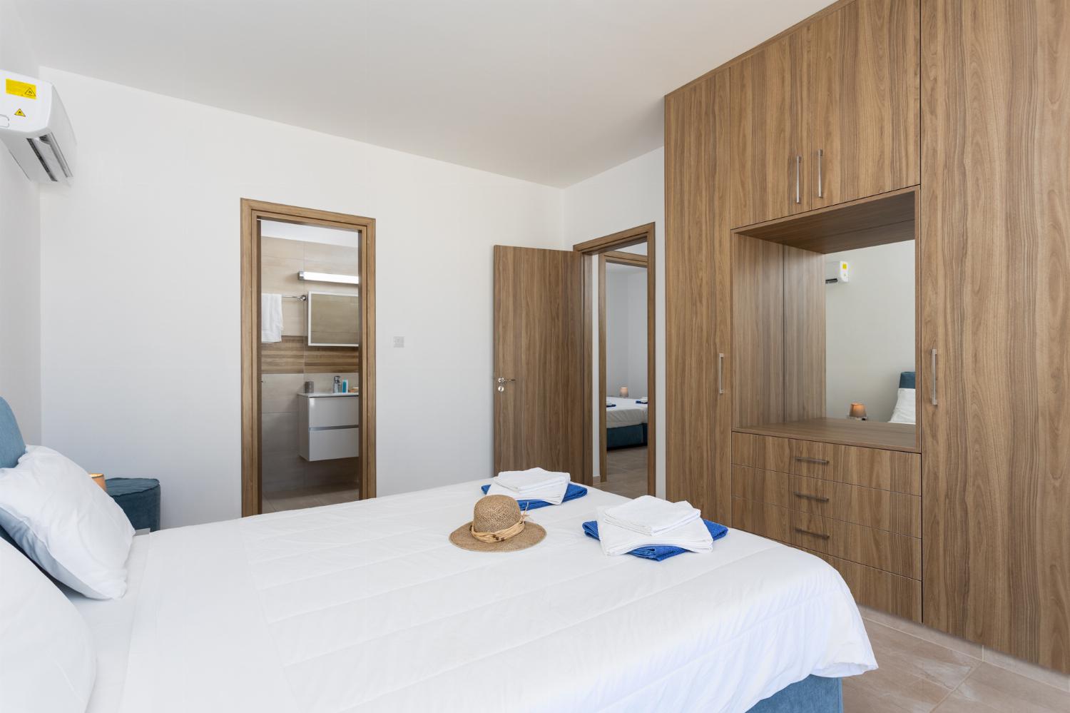 Double bedroom with en suite bathroom, A/C, and sea views