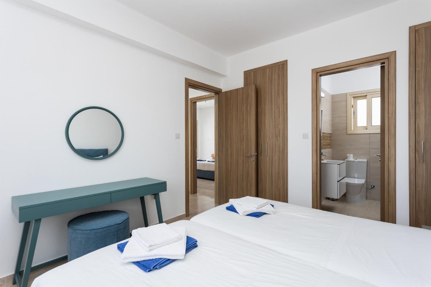 Twin bedroom with en suite bathroom and A/C