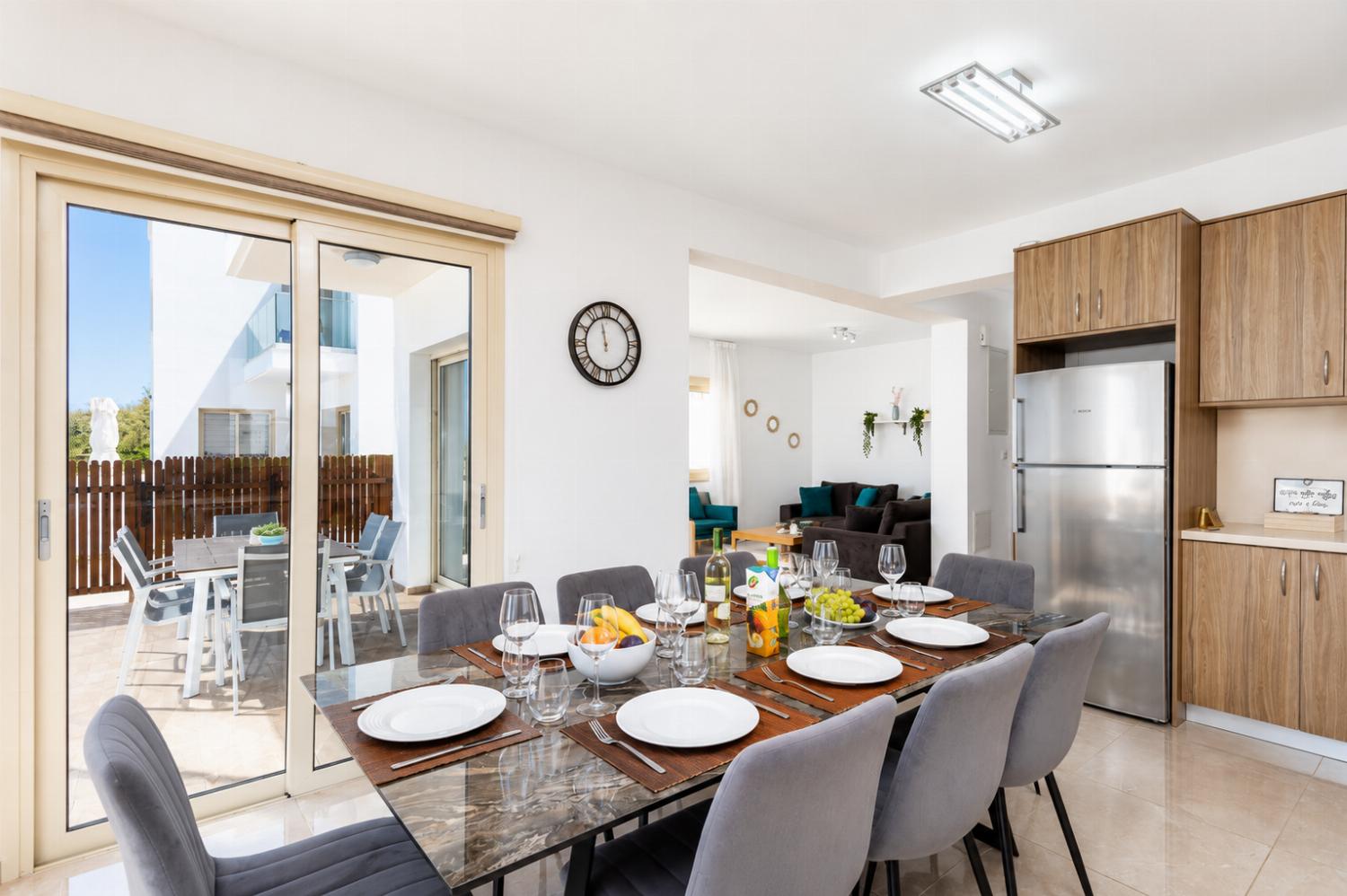 Open-plan living room with sofas, dining area, kitchen, A/C, WiFi internet, satellite TV, and sea views