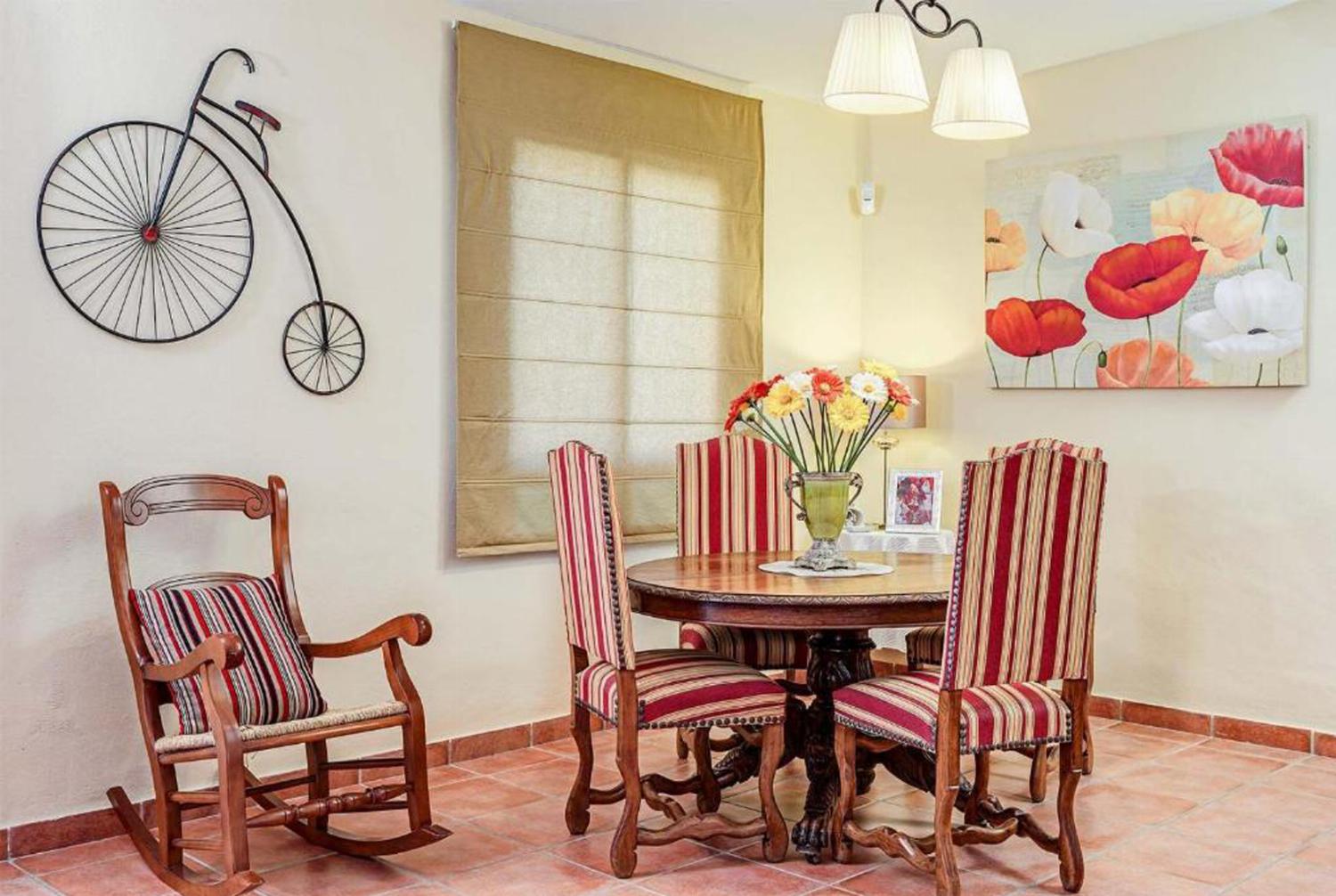 Open-plan living room with sofas, dining area, kitchen, WiFi internet, satellite TV, patio doors
