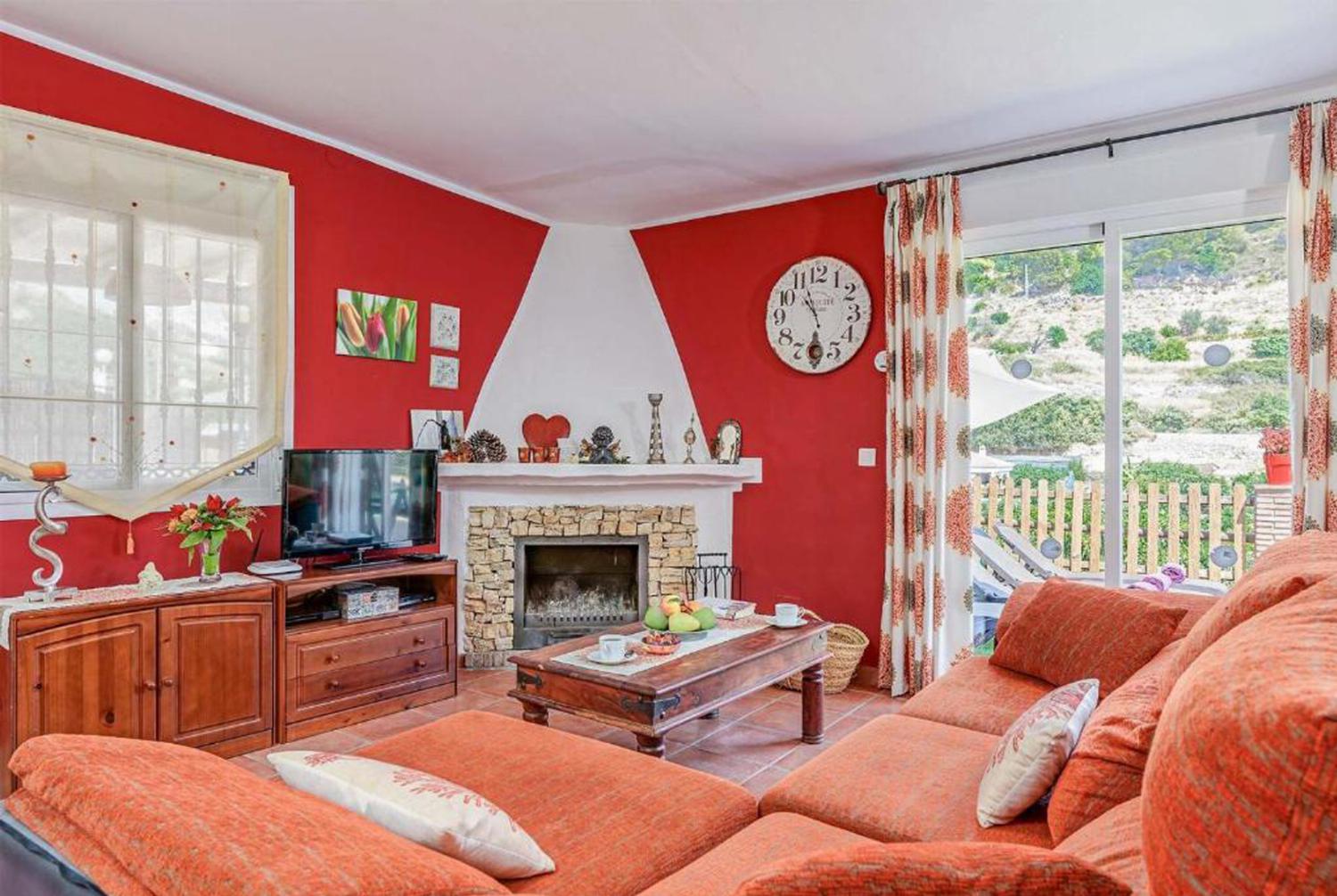Open-plan living room with sofas, dining area, kitchen, WiFi internet, satellite TV, patio doors
